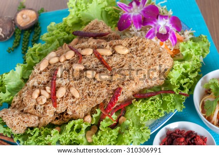 Thai spicy salad with catfish menu (thai food) with background (shooting set menu)