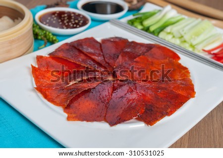 Peking Duck ready to serve shooting menu set with decoration and background