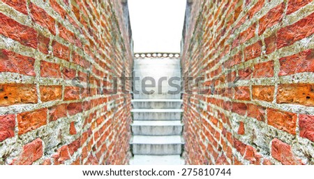 Lane between two red brick houses