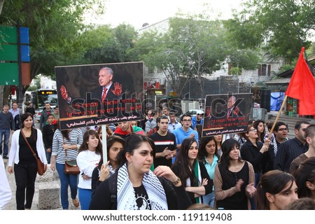 NAZARETH, ISRAEL - NOVEMBER 17: Hundreds of Israelis participate in anti war demonstration supporting Gaza in Nazareth Israel, 17 November 2012. Placard shows PM Netanyahu with blood on his hands.