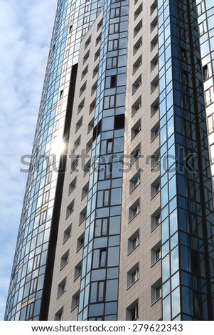 Samara, Russia, may 1, 2015 - sun, sky and clouds reflected in the Windows of a skyscraper called \