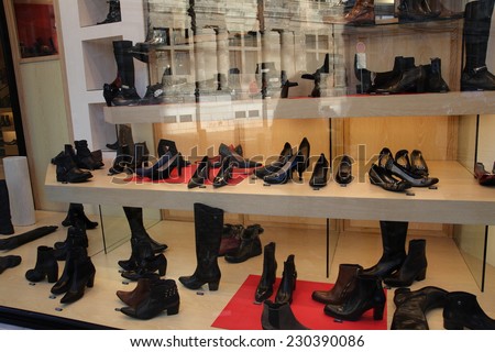 ARRAS, FRANCE: NOVEMBER 11, 2014: Shoes in a shop window. Shop selling luxury shoes in the city center of Arras, France