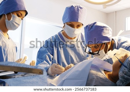 Similar – Image, Stock Photo Woman performing surgery in hospital