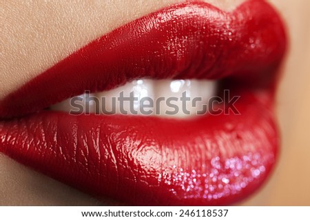 Shot close-up red lips with glitter