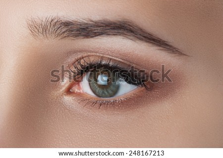 Golden smoke eyes close up with creative makeup