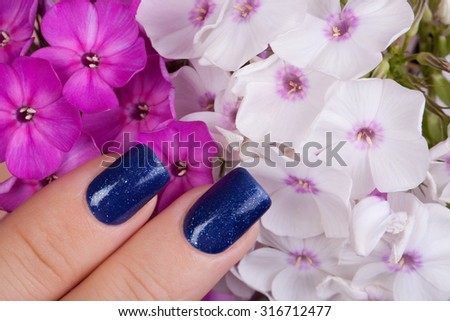 Beautiful nails and blue flower.