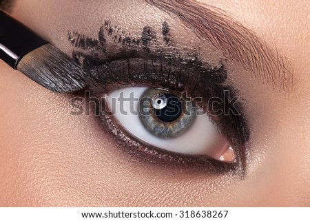 Black eye makeup closeup. Make-up colors aqua make-up done.