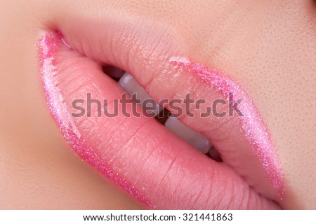 Pink lip gloss. Very nice lips close-up.