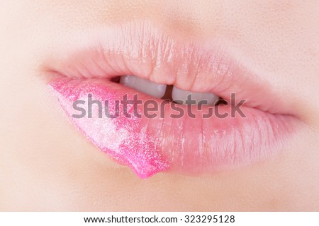 Pink glitter on natural lips. Close-up . Great idea for advertising lip gloss.