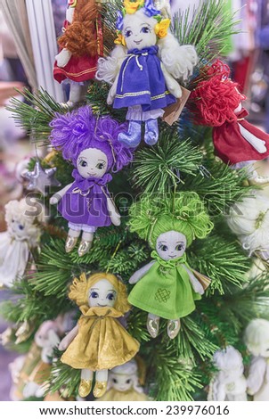 Moscow, December 19, 2014. Colorful rag dolls as Christmas toys are hanging on the Christmas tree