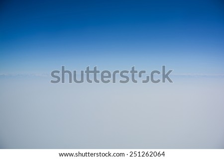 Clear blue sky with horizon line for background