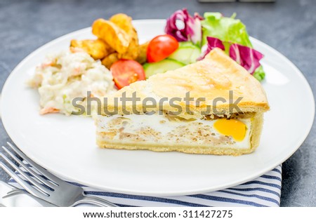 Bacon and egg pie with ships and salad