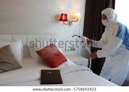 a technician is sanitizing an hotel room in Prague, using steam and ozone,  after the coronavirus SARS-CoV-2 COVID-19 pandemic
