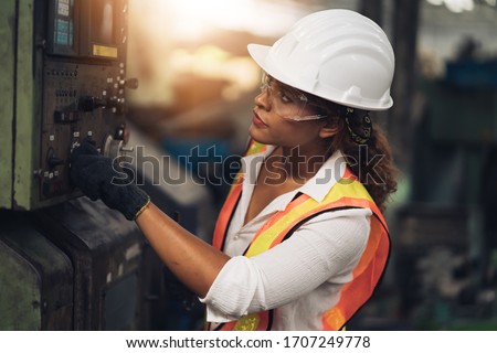 Professional engineer black women , worker, woman afican mechanical, maintenance, check in factory, warehouse Workshop for factory operators, engineering women training. Business factory industry.