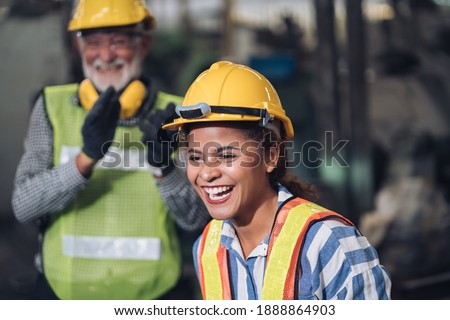 Similar – Image, Stock Photo Male warehouse employee in uniform standing near rack in warehouse