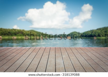 Beautiful landscape in thailand  raft for relax, have food and drink service. abstract blur out of focus for background and wood floor .