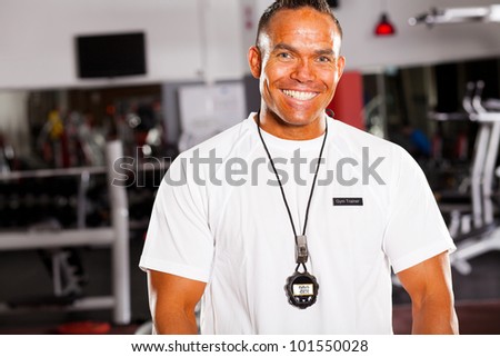 happy male personal trainer half length portrait