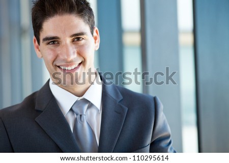 handsome businessman closeup portrait in office