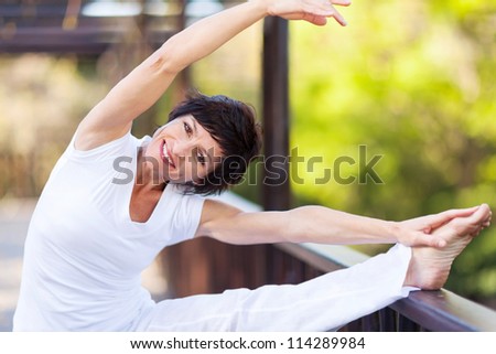 active middle aged woman stretching