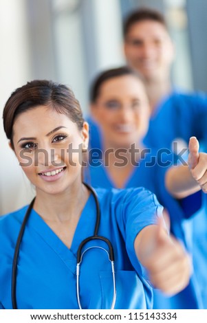 group of hospital staff thumbs up