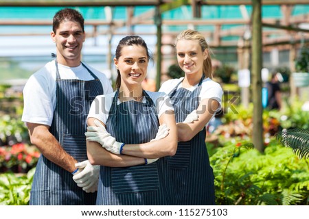 group of florists portrait in greenhouse
