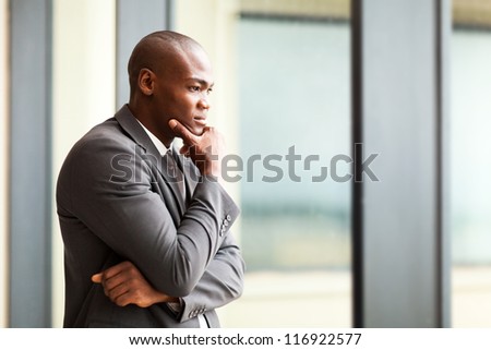 thoughtful african american businessman in office