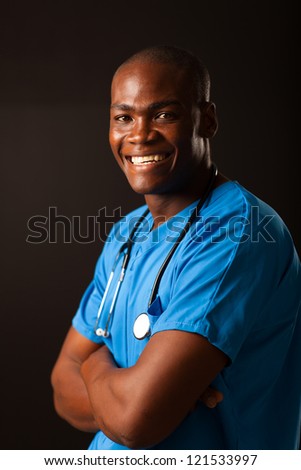 happy african american medical worker studio portrait over black background