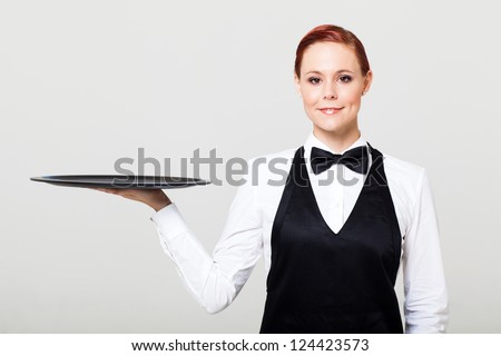 pretty waitress with an empty tray