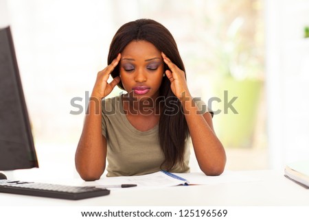 young female african american college student having headache