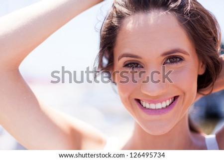 closeup of cute young woman laughing