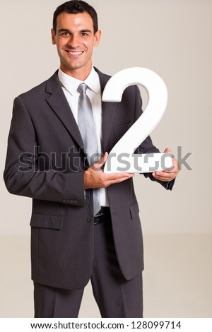 handsome businessman holding number 2