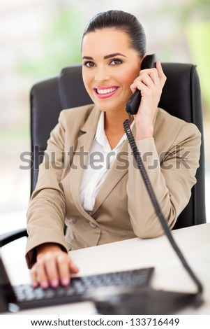 beautiful female switchboard operator answering telephone