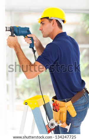 Similar – Image, Stock Photo Man worker drilling wall with hammer drill, top view