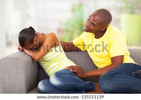 young african couple having problems, woman crying