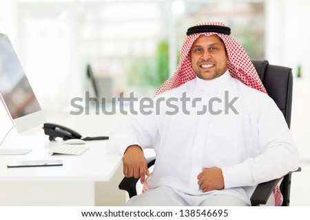 smiling arabian business man in office
