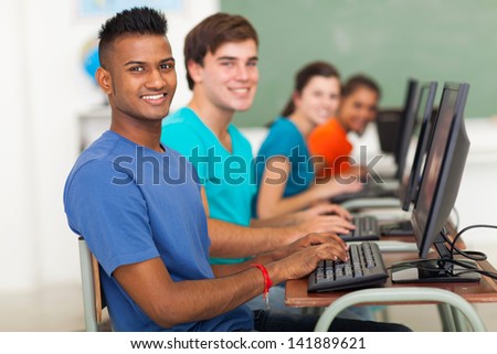 group of diversity high school students using computer in classroom