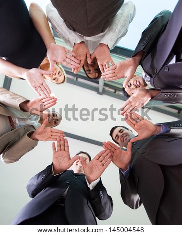 low angle view of business team hands together in circle