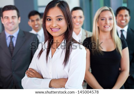beautiful young indian businesswoman and team in office
