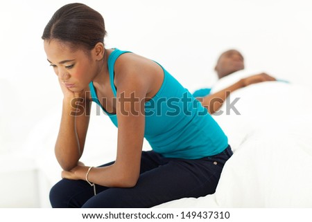 young afro american couple having an argument in bedroom