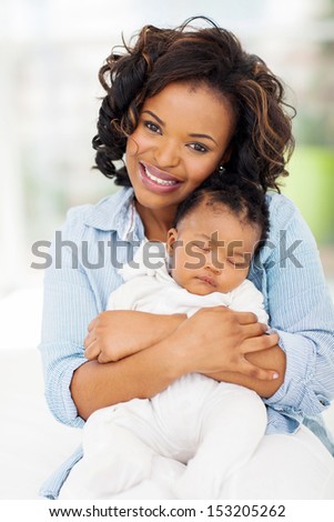 Beautiful Young African American Mother And Sleeping Baby Girl Stock ...