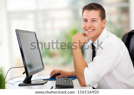 relaxed businessman sitting in modern office