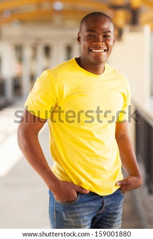 happy young african american man in shopping mall