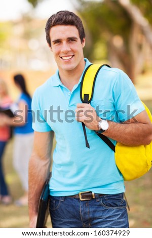 portrait of male university student outdoors on campus