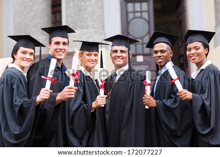group of young college graduates and professor at graduation