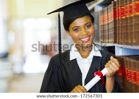 pretty female african college graduate in library