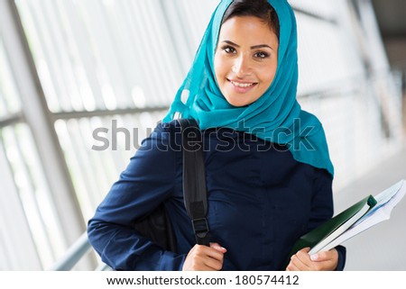 modern female muslim college student on campus