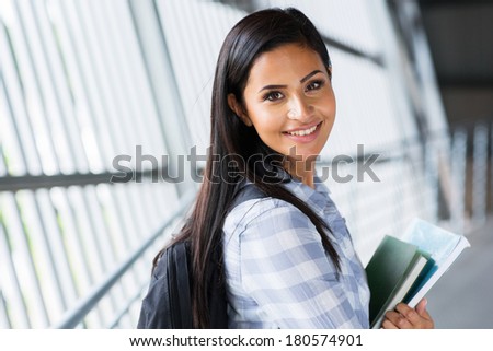 pretty female college student going to attend class