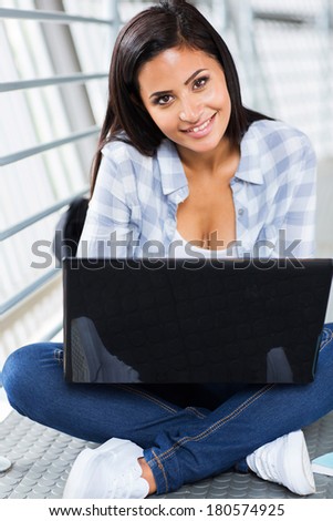 pretty female college student with laptop computer