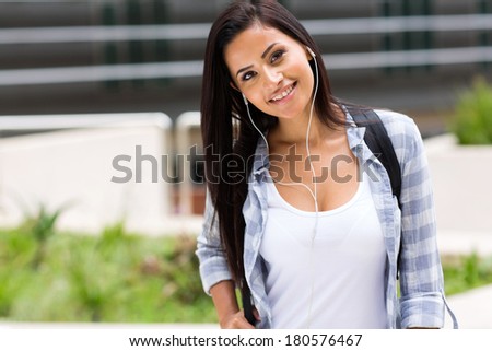 pretty college student listening to music