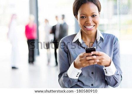 african businesswoman using smart phone in modern office